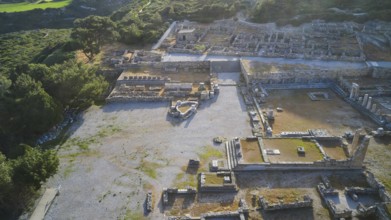Drone shot, first morning light, backlight, Ancient ruins in an archaeological site, surrounded by