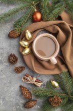 Christmas or New Year composition. Decorations, cones, cinnamon, fir and spruce branches, cup of