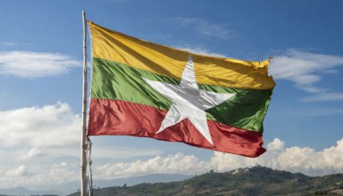 Flags, the national flag of Myanmar flutters in the wind