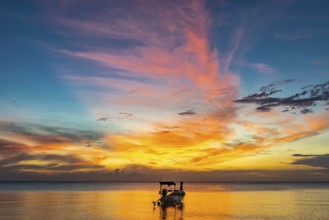 Longtail boat in sunset, sunset, horizon, evening light, boat, sun, evening mood, cloudy sky,