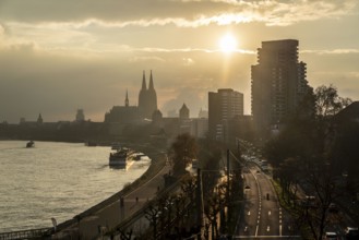 The Rhine near Cologne, sunset, Cologne Cathedral, cargo ship, North Rhine-Westphalia, Germany,