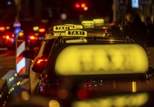 Illuminated taxi sign in the evening, symbolic photo, Stuttgart, Baden-Württemberg, Germany, Europe