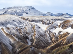 Early snow on the colorful rhyolite mountains, Landmannalaugar, Fjallabak Nature Reserve, Iceland,