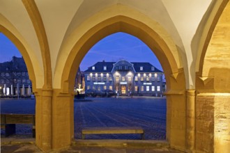 View from the open hall of the late Gothic town hall in Goslar in the evening onto the market