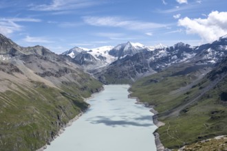 Picturesque mountain landscape, view of a blue mountain lake, Lac des Dix reservoir, behind