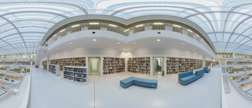 Modern library with glass roof and white stairs, surrounded by bookshelves in a bright open space,