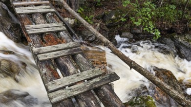 Wooden bridge over a stream, near Kvam, Gudbrandsdalen, Norway, Europe
