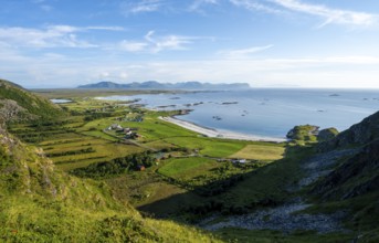 View of the coast with the village of Stave, beach and sea, hike to the summit of Måtind, Andøya