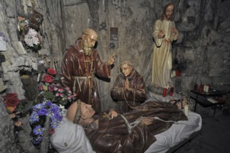 Interior of the Grotto of St Anthony of Padua, Saint-Antoine de Padoue showing praying monks at