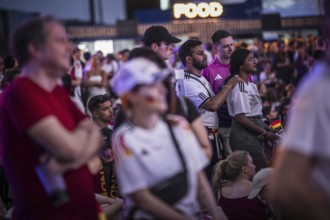 Scenes in the fan zone on Platz der Republik in front of the Reichstag building taken in Berlin, 29