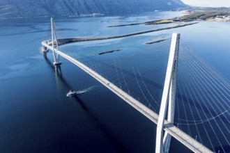 Aerial view of Helgeland bridge, connecting Sandnessjøen with the norwegian mainland, fishing boat