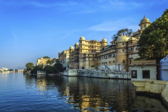 Romantic India luxury tourism concept background, Udaipur City Palace and Lake Pichola. Udaipur,