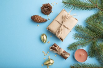 Christmas or New Year composition. Decorations, box, cinnamon, cones, fir and spruce branches, on a