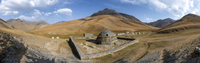 Historic caravanserai Tash Rabat from the 15th century, with yellow hills, Atbashy district in the