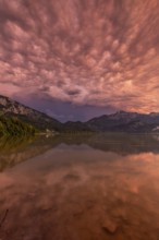 Stormy atmosphere, mountains reflected in lake, Lake Kochel, Alpine foothills, Bavaria, Germany,