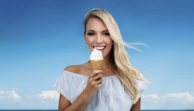 A blonde woman enjoys eating an ice cream in a cone