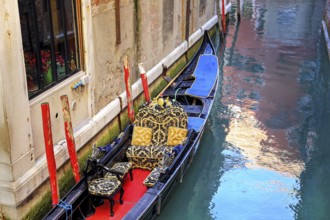 Luxury Gondola waiting for tourists near Rialto Bridge in Venice