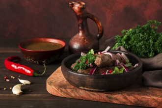 Georgian dish, fried Kupaty sausages, Ketsi on a traditional clay pan, horizontal, no people,