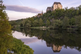 Mildenstein Castle and St Matthäi Church reflected in the Freiberger Mulde, Leisnig, Saxony,