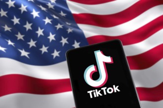TikTok logo from China with USA United States of America flag social media on a mobile phone in