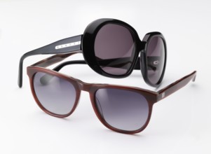 Two stylish sunglasses on a white background, studio shot