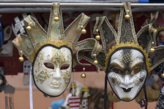 Venetian carnival masks in front of a shop, Burano, Veneto, Italy, Europe