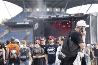 Adenau, Germany, 8 June 2024: Fans enjoy Rock am Ring Festival. The festival takes place at the