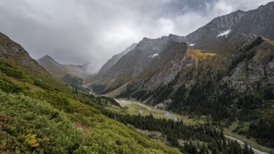 Green mountain valley with river and steep mountain peaks, Chong Kyzyl Suu Valley, Terskey Ala Too,