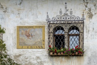 Sundial on a weathered house facade, Kaltern, South Tyrol, Italy, Europe