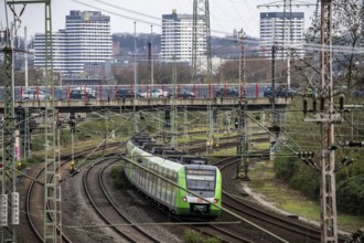 S-Bahn train on the railway line between Mülheim an der Ruhr, in the background and Duisburg, busy