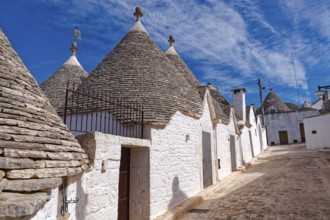 Whitewashed trulli, round houses with stone roofs, in the southern Italian town of Alberobello. The