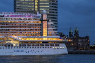 Cruise ship Aida Prima at the Cruise Terminal of Rotterdam, Kop van Zuid, skyscrapers at the