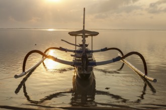 Fishing outriggers at dawn, Sanur, Bali, Indonesia, Asia