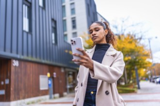Beauty african woman using smartphone to find a direction in the city