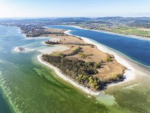 Aerial view of the Mettnau peninsula at low tide and spring-like vegetation, on the horizon the