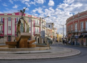 Loule, Algarve, Portugal - Houses with colourful facades in the old town of Loulé, roundabout with