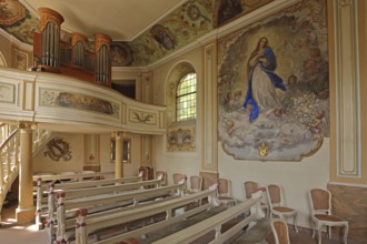 Idyllic small baroque castle chapel, interior view, organ with gallery, painting with Madonna