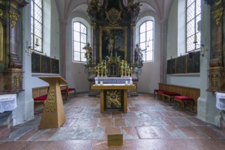 Parish church of St Sebastian with richly decorated altar, statues of saints and paintings, framed