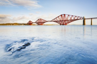 View of the red railway bridge Forth Bridge at the Fírth of Forth estuary near South Queensferry,