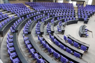 Empty plenary chamber in the German Bundestag, equipped with office swivel chairs in the special