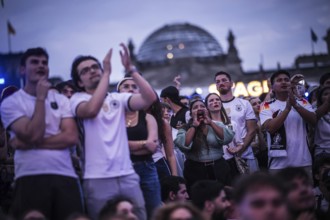 Scenes in the fan zone on Platz der Republik in front of the Reichstag building taken in Berlin, 29