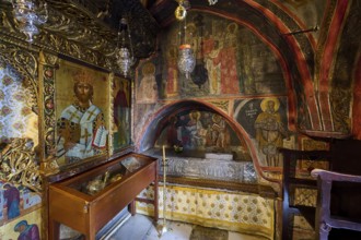 Magnificent interior of an Orthodox church with religious murals and icons, Inside the monastery,