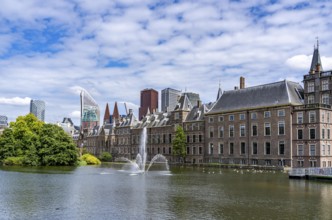 The historic Binnenhof, seat of the Dutch government, Hofvijver pond, skyline of the city centre at