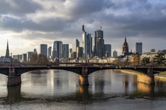 Skyline of the city centre of Frankfurt am Main, river Main, Ignatz-Bubis-Bridge, dusk, Hesse,