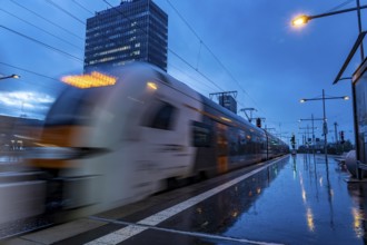 RRX train, regional express, Rhine-Ruhr-Express, train traffic, city centre skyline, Essen central