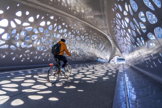 Light effects from the sun in the Parkbruk, a cycle and pedestrian bridge in the city centre of