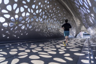 Light effects from the sun in the Parkbruk, a cycle and pedestrian bridge in the city centre of