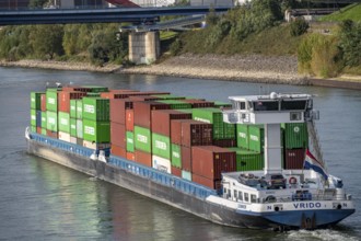 The Dutch cargo ship Vrido, loaded with containers, on the Rhine near Duisburg, downstream, North