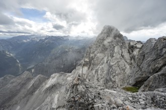 Clouds around a narrow rocky ridge, Watzmann crossing to Watzmann Mittelspitze, view of mountain