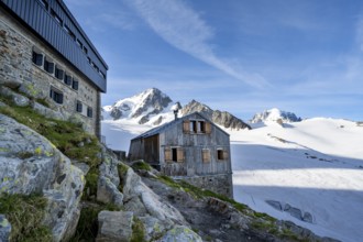 Old and new mountain hut Refuge Albert 1er, high alpine mountain landscape, summit of the Aiguille